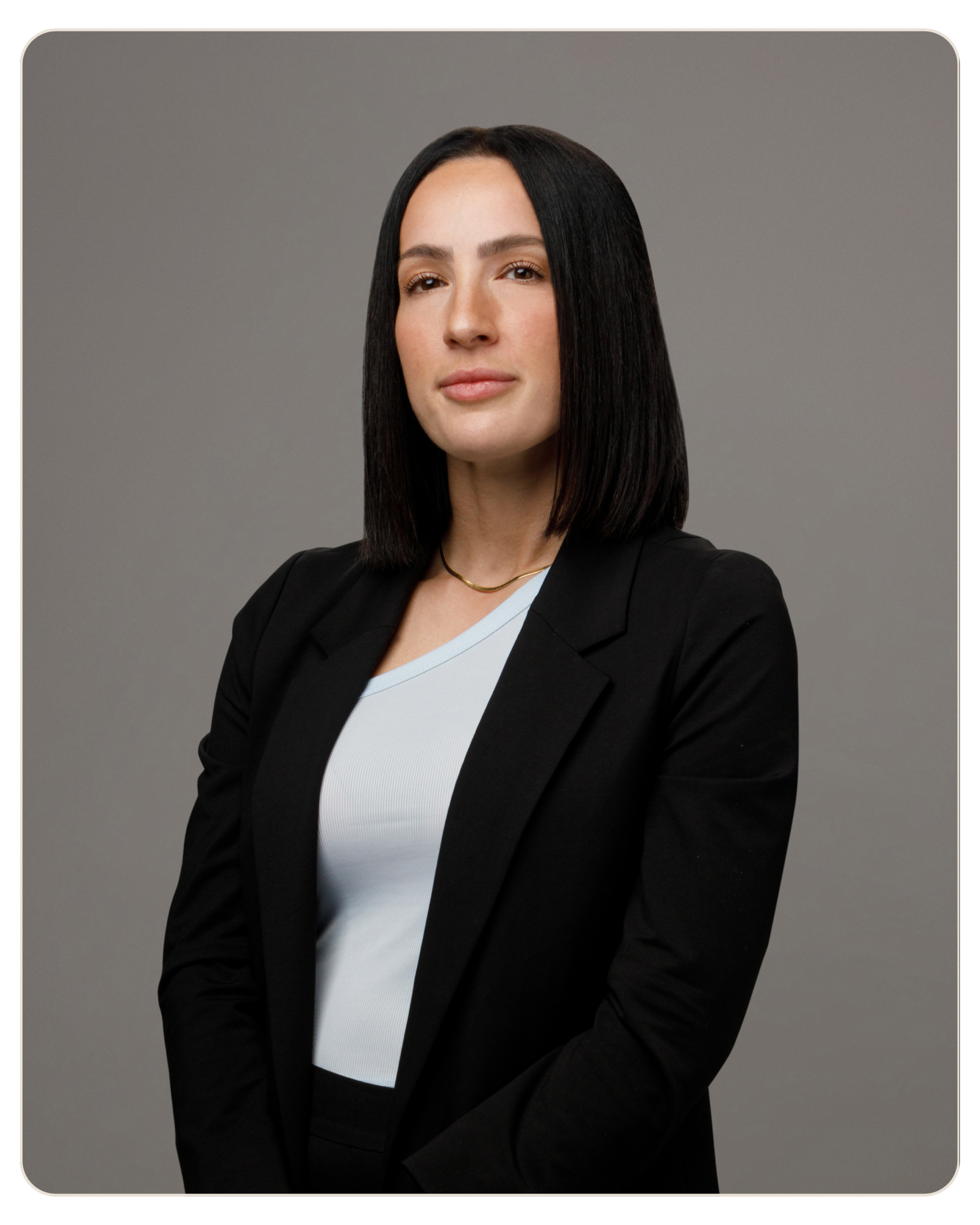 Maryann Ricci Owner, Chief Financial Officer Professional portrait of a woman with straight black hair, wearing a black blazer and light blue top against a neutral gray background.